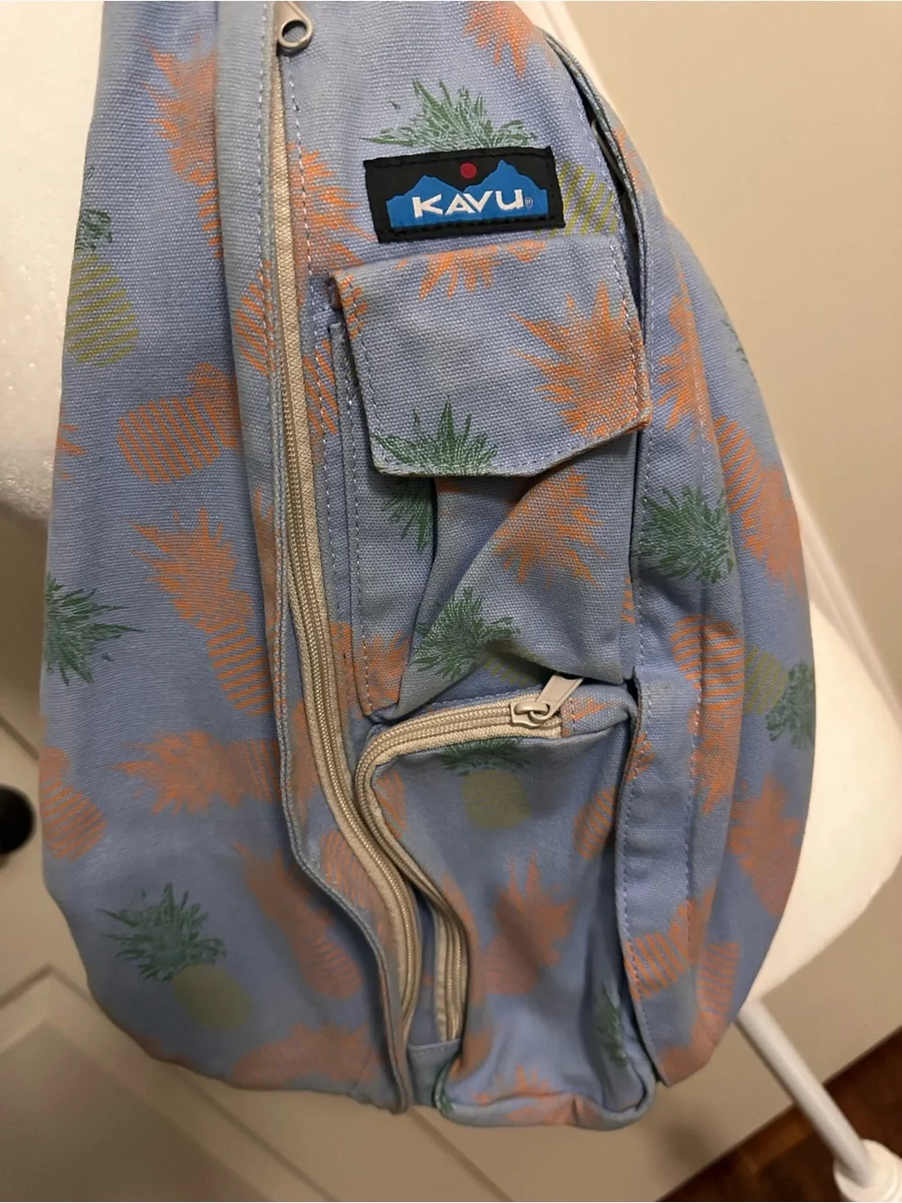 Kavu Pineapple Print Light Blue Sling Bag with Orange Strap